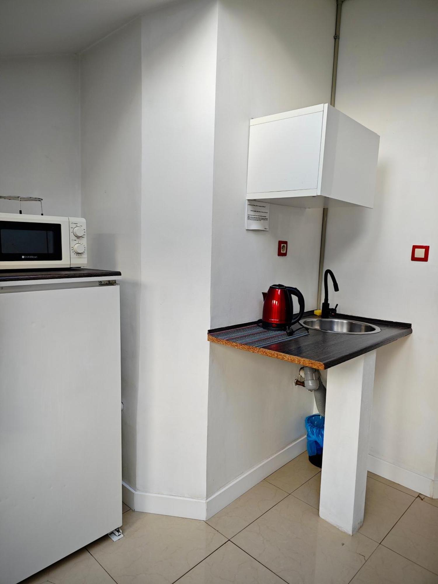 Apartamenty Hoza Attic Studio Varsó Szoba fotó