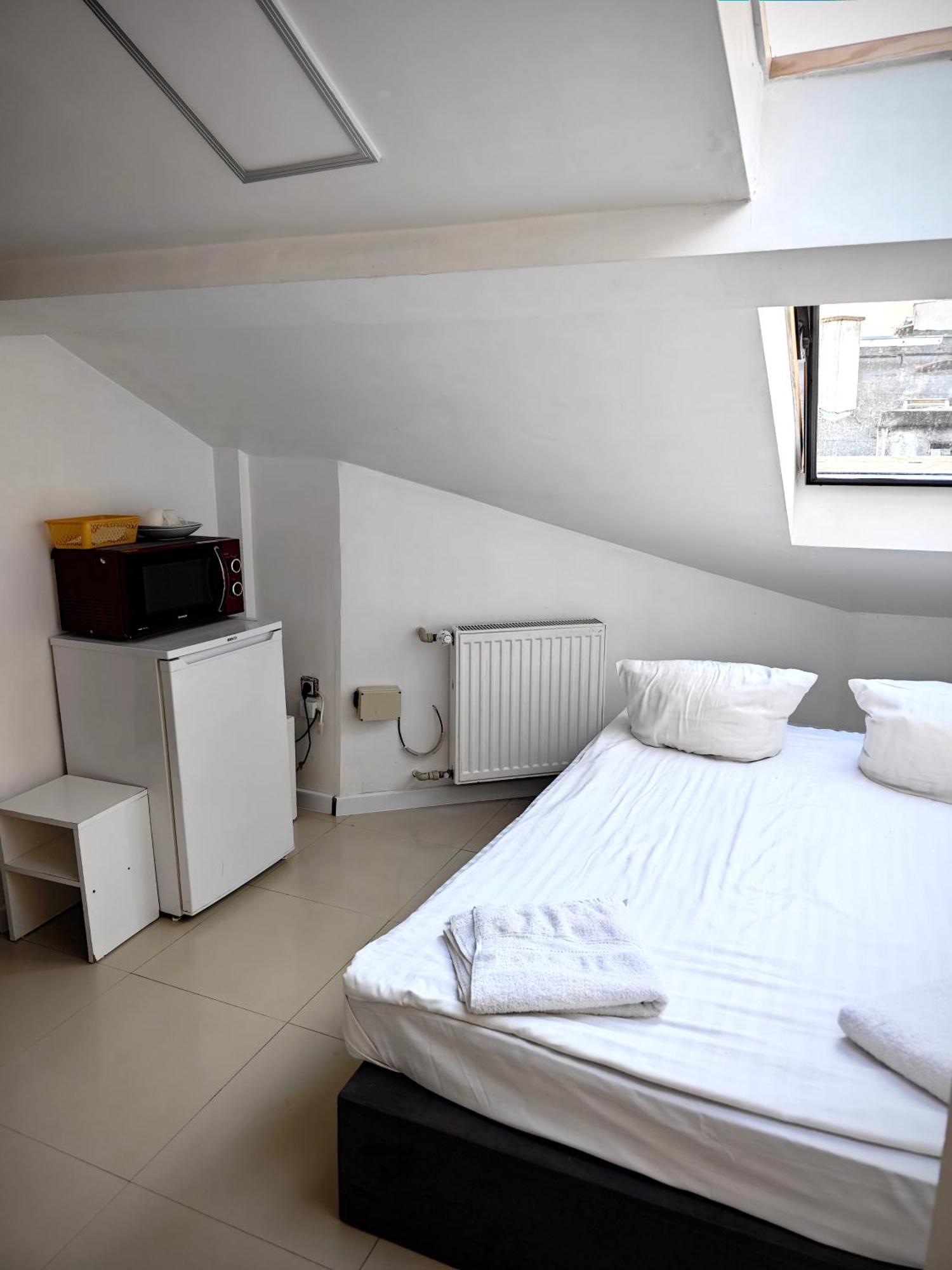 Apartamenty Hoza Attic Studio Varsó Szoba fotó